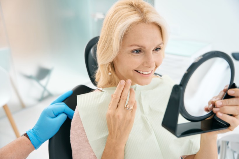Patient smiling in the dental chair during a checkup